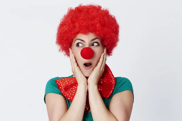 Excited clown in red wig — Stock Photo, Image