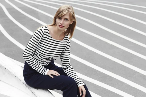 Beautiful woman in striped top — Stock Photo, Image