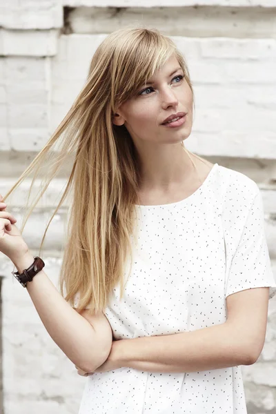 Beautiful blond in white dress — Stock Photo, Image