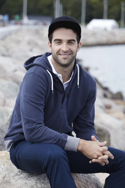 Man in cap  smiling — Stock Photo, Image