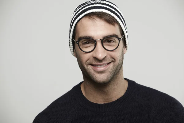 Man in hat and glasses smiling — Stock Photo, Image