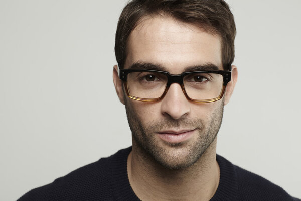man in glasses posing