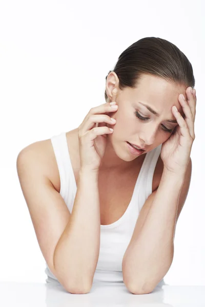 Woman with head in hands — Stock Photo, Image