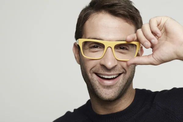 Man in yellow glasses smiling — Stock Photo, Image