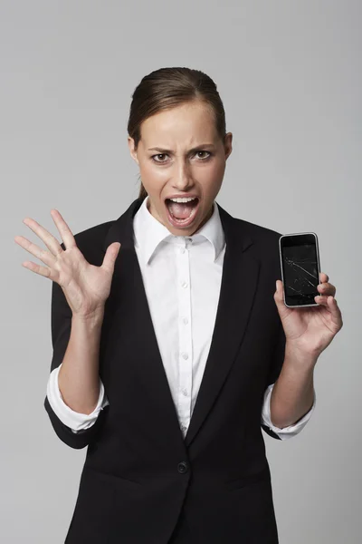 Businesswoman holding cellphone — Stock Photo, Image