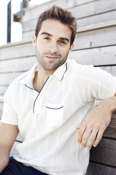 Man in polo shirt smiling