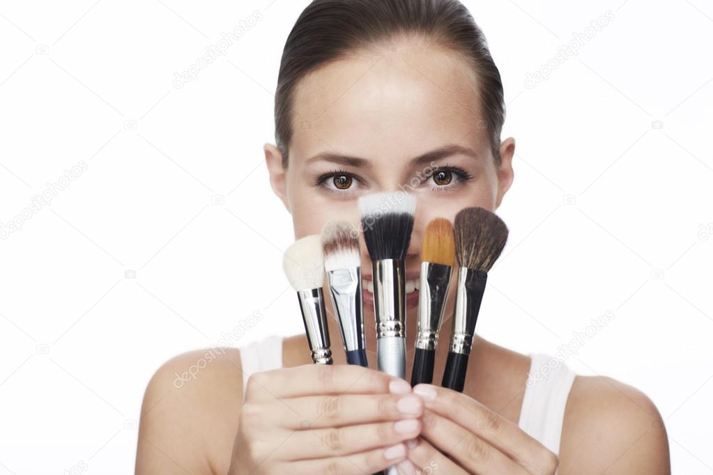 Woman holding  brushes