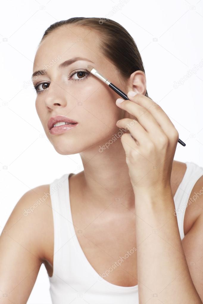 Woman applying eye shadow