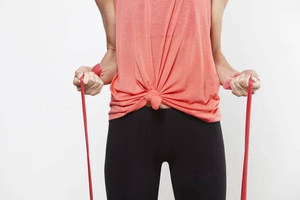 Woman using sports elastic bands — Stock Photo, Image