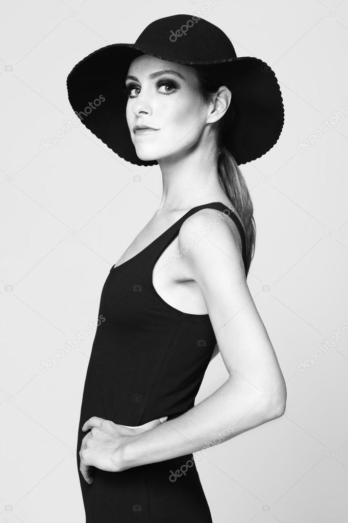 Woman in hat posing