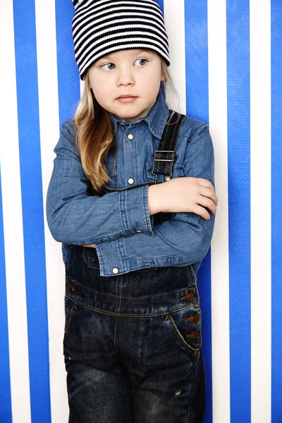 Girl in stripy hat posing — Stock Photo, Image