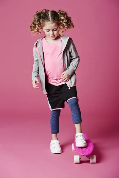 Cool girl on skateboard — Stock Photo, Image