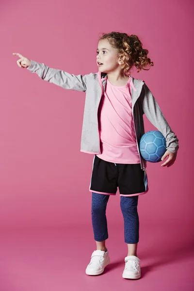 Girl holding blue ball — Stock Photo, Image