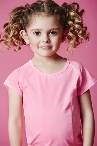 Girl in pink smiling — Stock Photo, Image