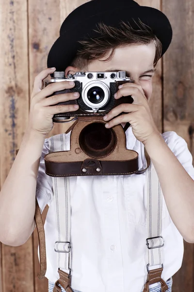 Boy taking photograph with old camera — Stock Photo, Image
