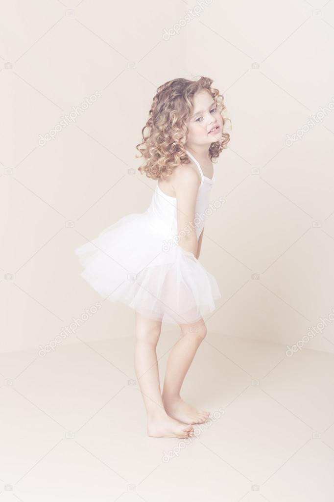 Young ballerina in studio