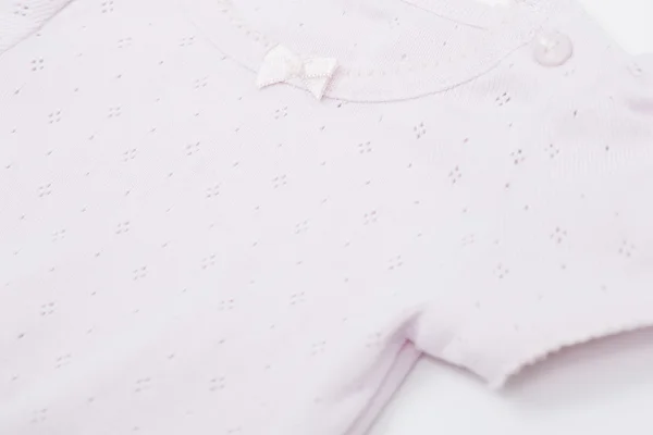 Close up van roze babygro — Stockfoto