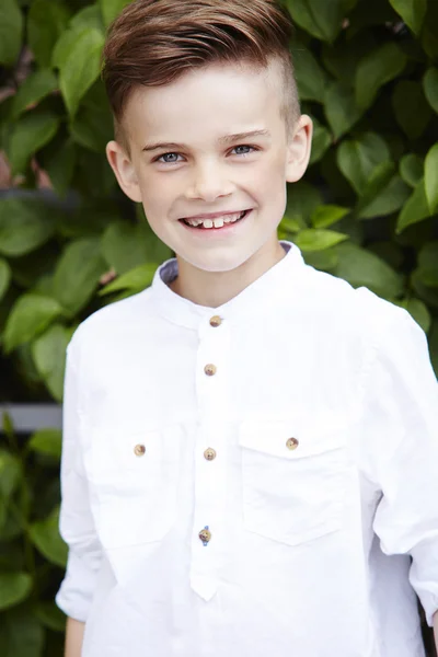 Young boy in white shirt — Stock Photo, Image