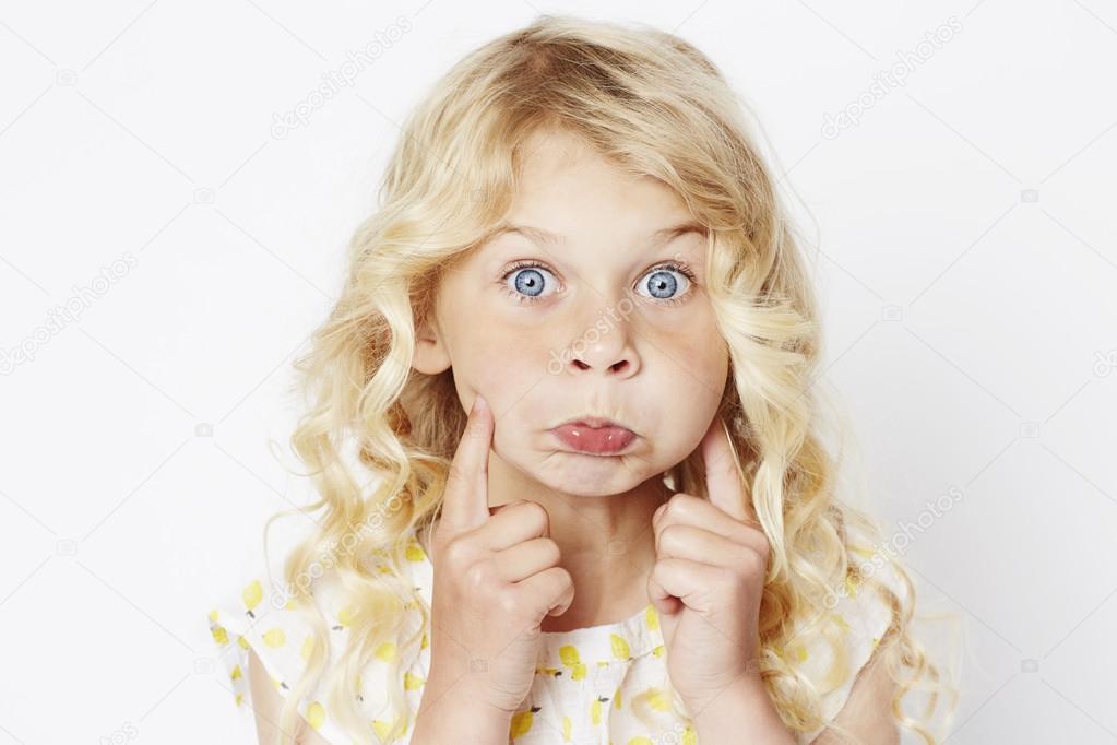 Young Girl Pulling Funny Face Stock Photo Image By C Sanneberg