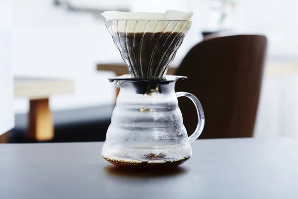 Coffee percolating into glass — Stock Photo, Image