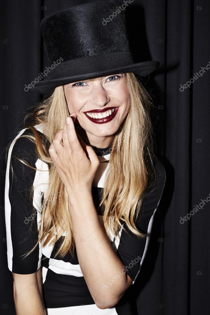 Woman smiling in top hat — Stock Photo © sanneberg #82224784