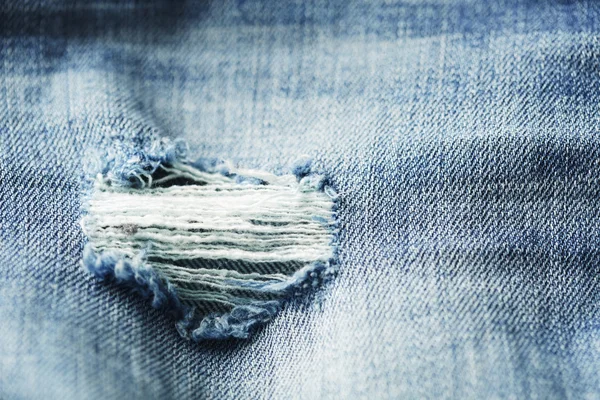 Close-up van versleten jeans — Stockfoto