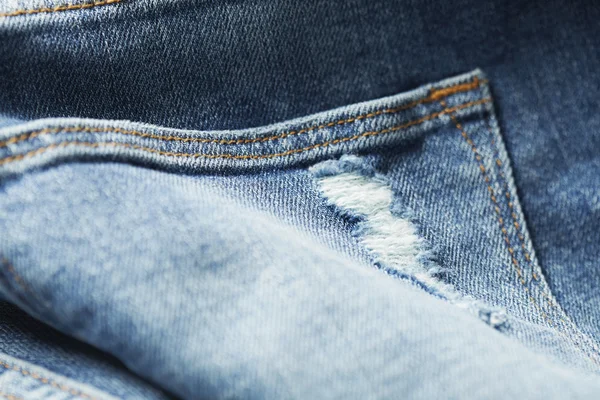 Close-up van versleten jeans — Stockfoto