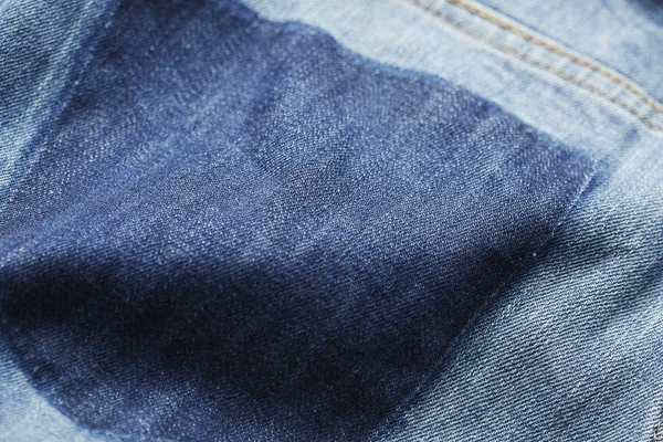Stuk gehanteerd denim jeans — Stockfoto