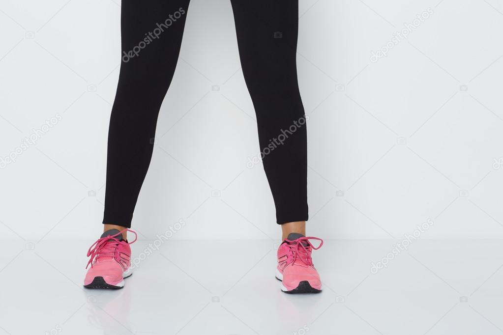 Woman in leggings and sneakers