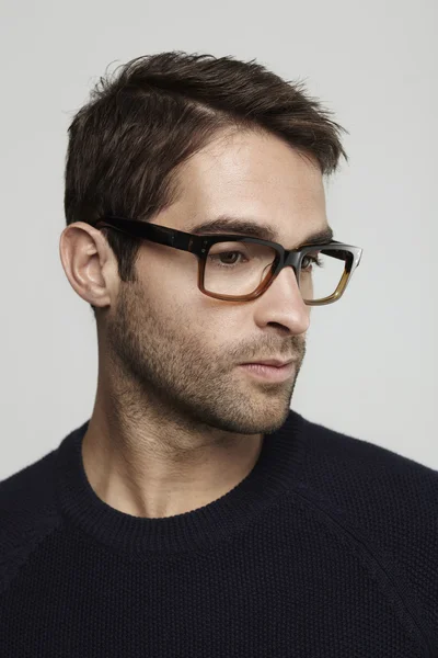 Thoughtful man in glasses — Stock Photo, Image
