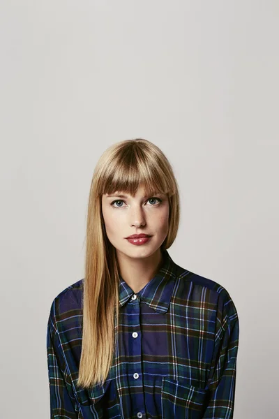 Confident woman in checked shirt — Stock Photo, Image
