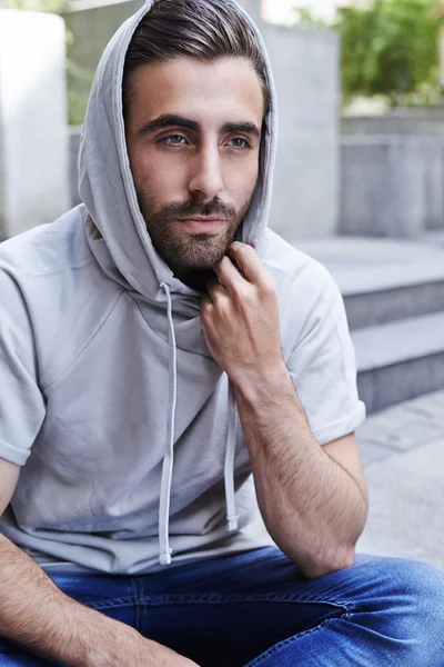 Cool man in hooded top