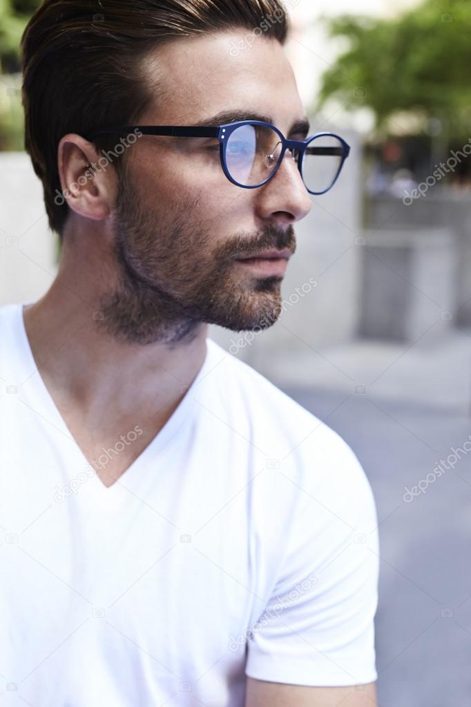 Young man on cool spectacles
