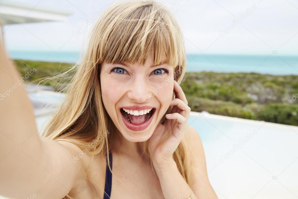 Excited young blond woman