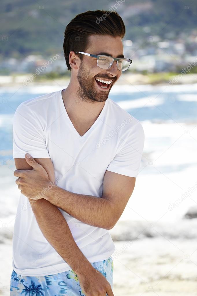 Young man smiling in spectacles