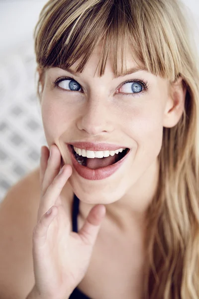 Excited young blue eyed woman — Stock Photo, Image