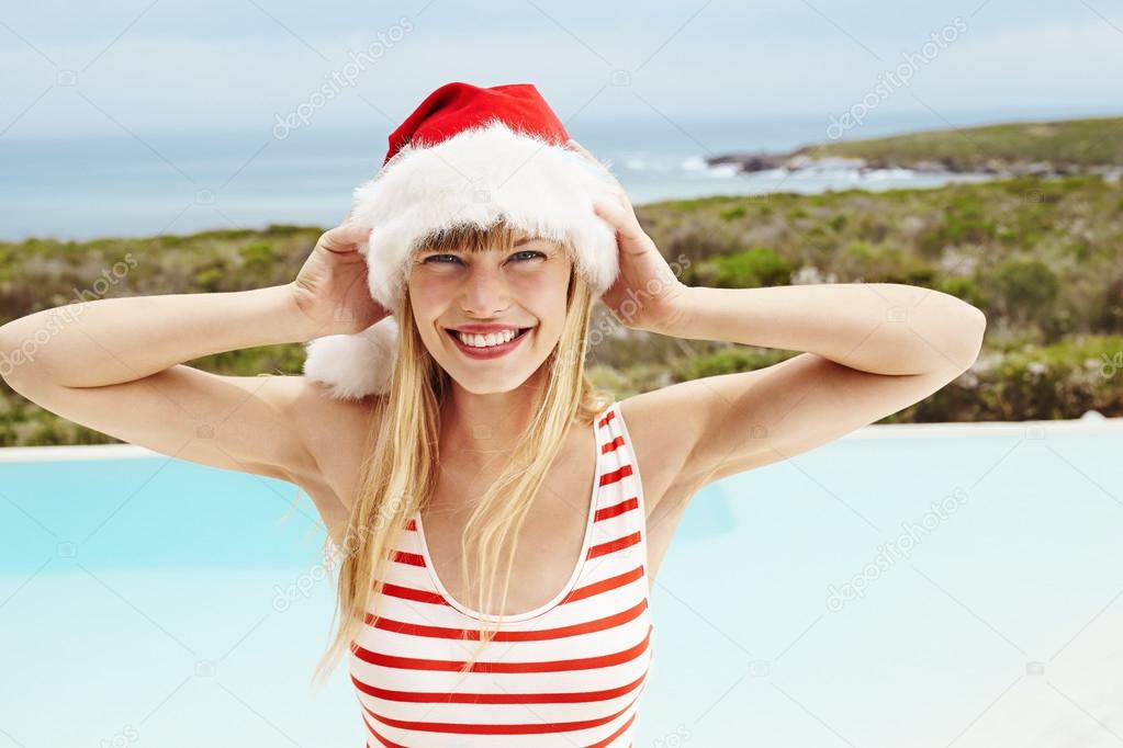 Swimsuit model in Santa hat