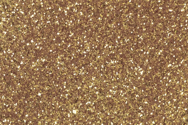 Arka plan ile parlak altın glitter dolu. Düşük kontrast fotoğraf. — Stok fotoğraf