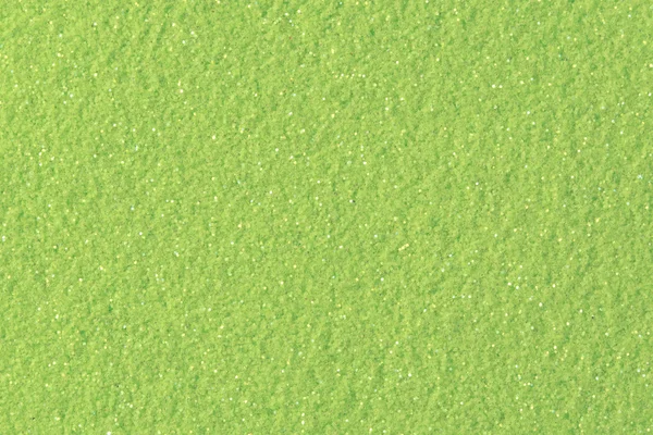 Lime glitter background.  Low contrast photo.