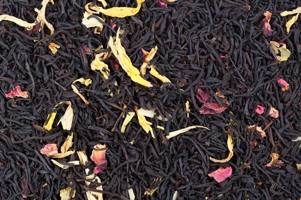 Blandning av rosenblad, solros, mandel och svart te. — Stockfoto