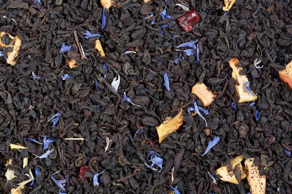 Drogen van groene thee met segmenten van Oranje-schillen en een bergamot. — Stockfoto