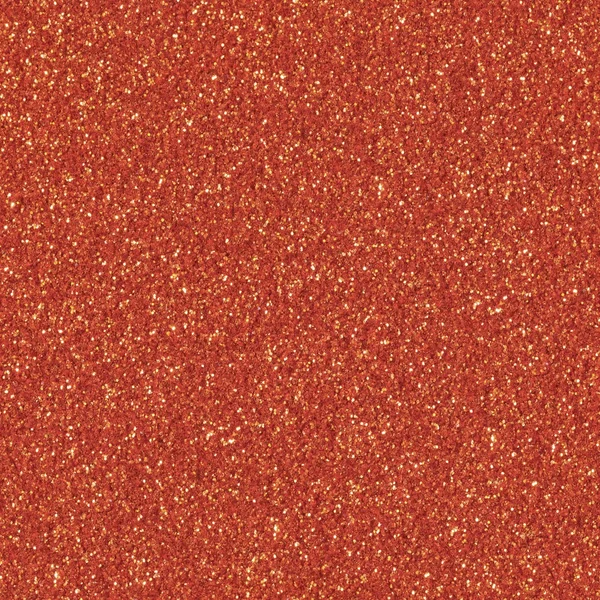Orange glitter sparkle. Background for your design. Low contrast photo. Seamless square texture. Tile ready.