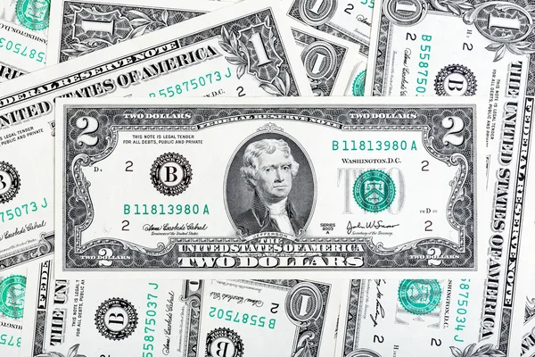En dollar och två dollar bill. — Stockfoto