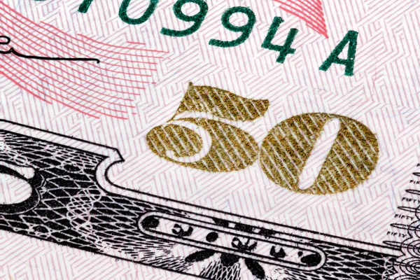 Makro gestapelte Aufnahme der Zahl 50. Fragment einer 50-Dollar-Banknote (Schein). — Stockfoto