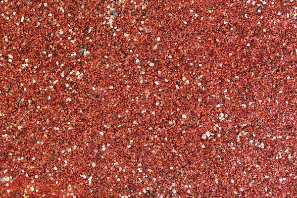 Texture of surface covered with small red stones. — Stock Photo, Image
