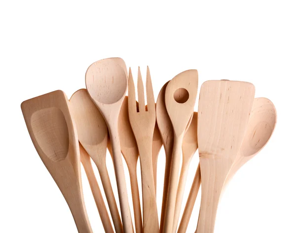 Surtido de diferentes utensilios de cocina de madera cubiertos en blanco . — Foto de Stock