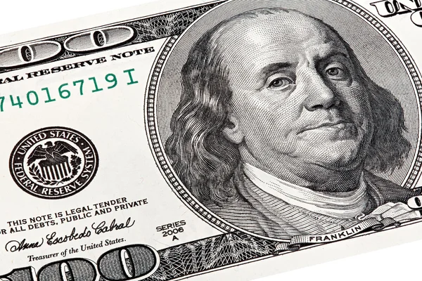 Stack shot of Benjamin Franklin portrait from a 100 bill. — Stock Photo, Image