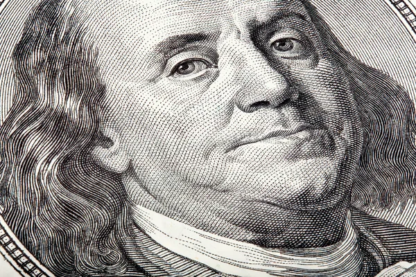 Benjamin looking at you on money. stacked macro photo. — Stock Photo, Image