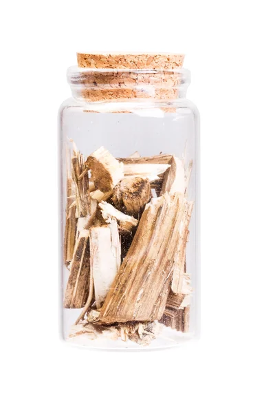 Dry Burdock in a bottle with cork stopper for medical use. — Stock Photo, Image