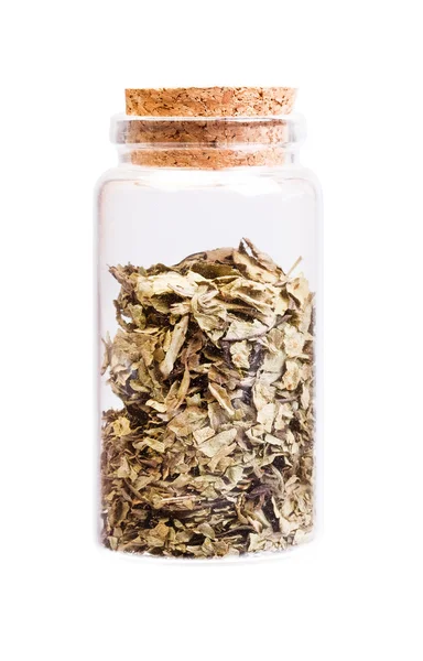 Medicinal herb in a bottle with cork stopper for medical use. — Stock Photo, Image
